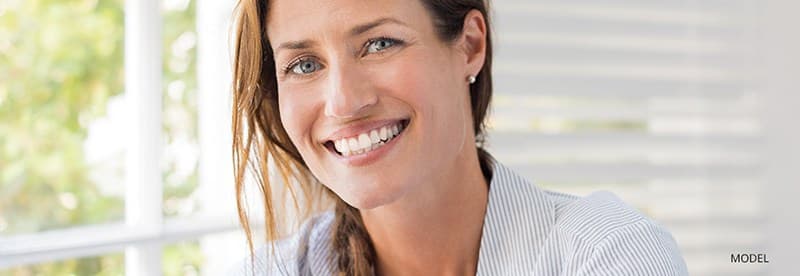 Woman with brown hair smiling