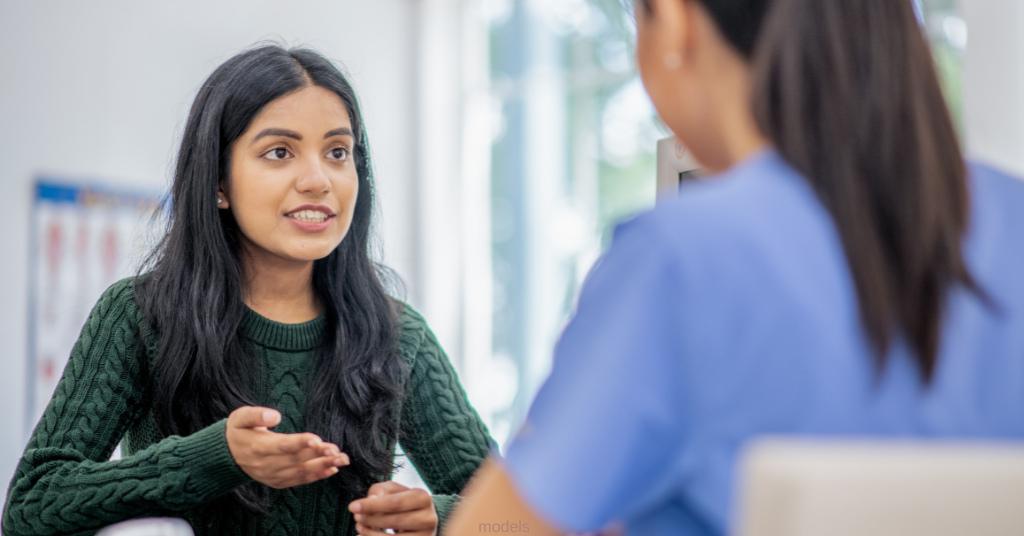 woman consulting nurse