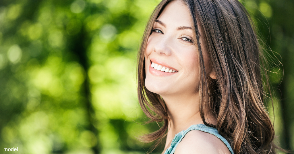 woman smiling after Kybella treatment (model)